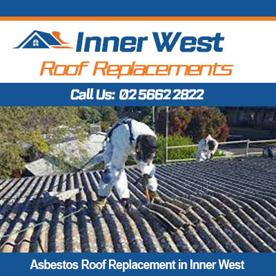 Asbestos roof replacement in Inner West with workers installing new corrugated metal roofing