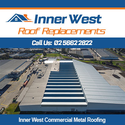 Aerial view of commercial metal roofing in Inner West with solar panels on warehouse facility